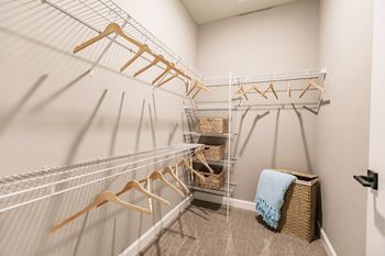 spacious closet with hangers and shelving